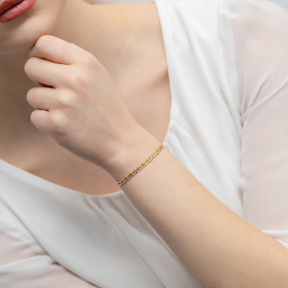 Zlatý náramek s dvojitými vlnami