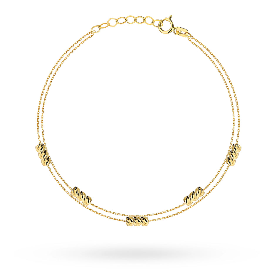 Zlatý náramek s korálky