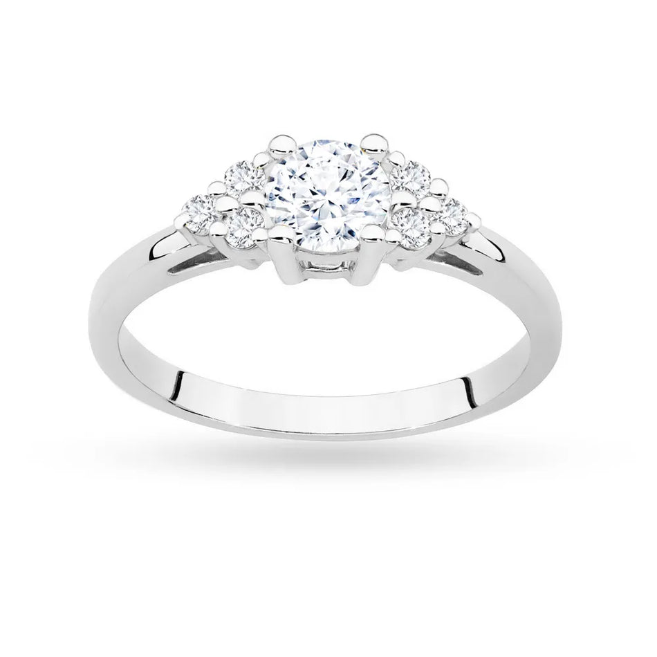 Goldring mit 0,60ct weißem Saphir und 6 Diamanten