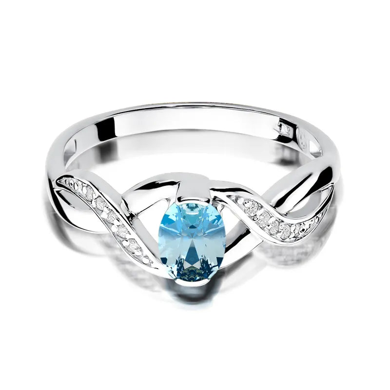 Zlatý prsten s topazem 0,50 ct a diamanty 0,05 ct