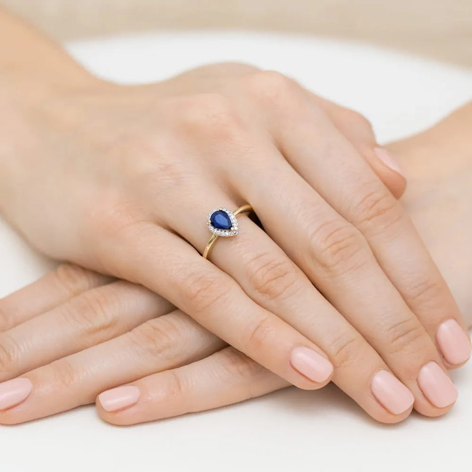 Goldring mit 0,60 ct Saphir und 0,105 ct Diamanten