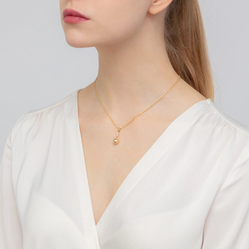 Zlatý přívěsek závěsná kulička se zirkony